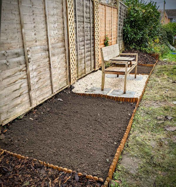 Transformed border complete with new trellis, edging and seating area